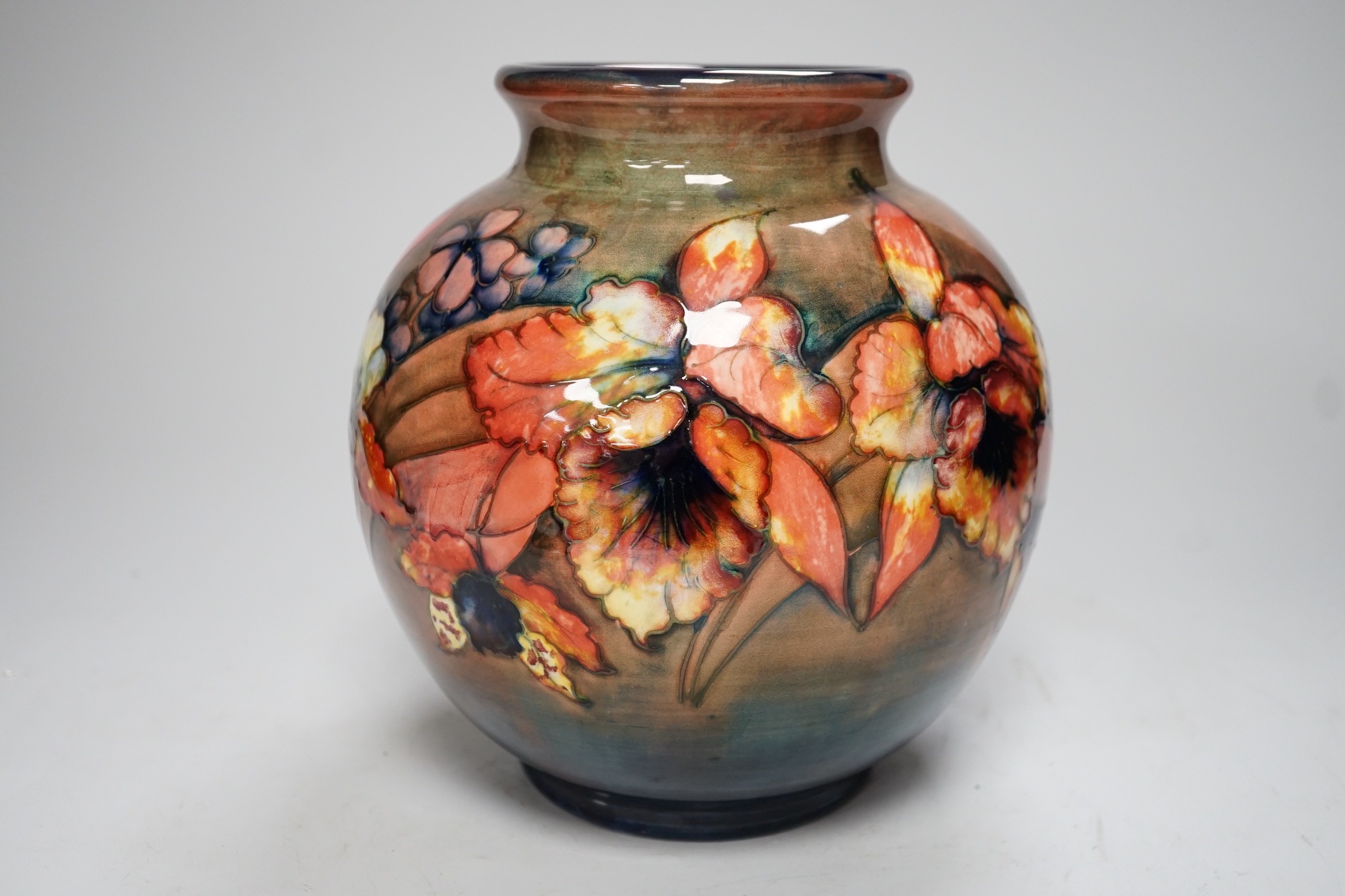 A Moorcroft flambé ‘orchid’ globe shaped vase, 21cm